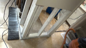 Exposed framing under a kitchen island during water damage demolition and restoration by Utah Disaster Specialists in Syracuse, UT.