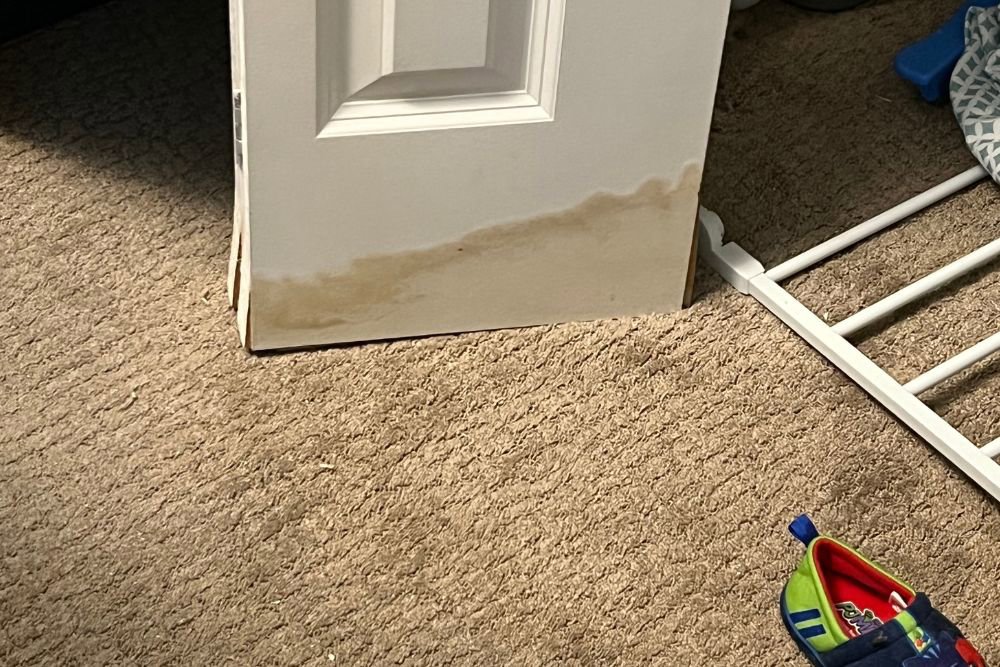An exposed wall with drywall removed, showing studs and insulation during water damage repair by Minneapolis Water Damage Specialist 24/7 in Minneapolis, MN.