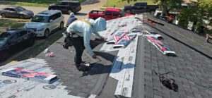 Workers installing new exterior wood panels on a home's soffit by Home Quality Solutions,LLC in Old Orchard Beach, ME