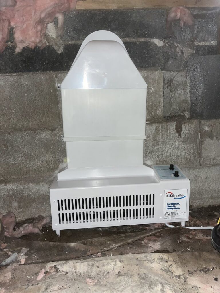 An EZ Breathe ventilation system installed on a concrete block wall by EverDry Toledo in Toledo, OH.