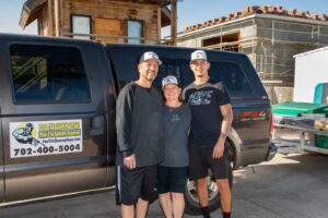 The family team of Pool Tile Cleaning Vegas standing proudly in front of their service truck in Las Vegas, NV.