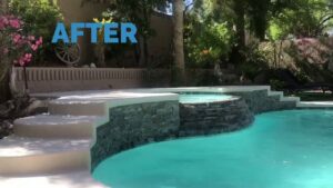 A beautifully finished pool and spa with stone accents and lush landscaping by Fix A Pool in Las Vegas, NV