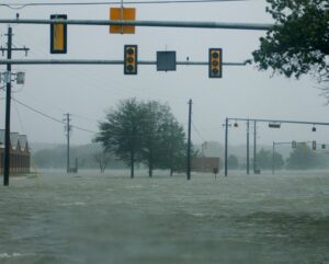 A street completely submerged in floodwater after a storm, indicating severe water damage needing Emergency Response Services Inc. in Warren, MI