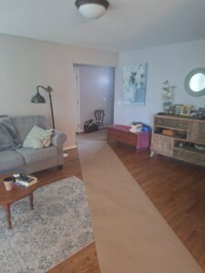 A protective floor runner laid out on carpet and hardwood during a water damage job by Flood Force in Dayton, OH.