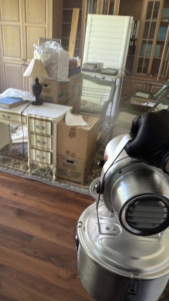 A fogger being used for antimicrobial treatment or odor removal during water damage restoration in Syracuse, UT by Utah Disaster Specialists.