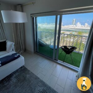 A freshly cleaned living room with a balcony overlooking the city, by The Prime Cleaner in Miami, FL.