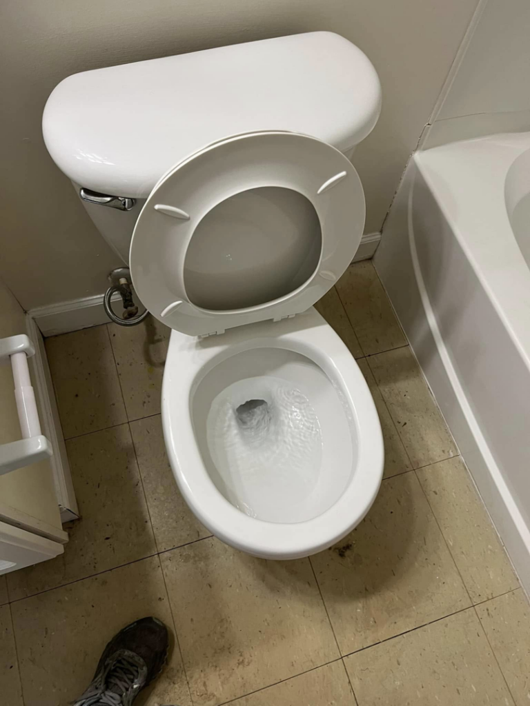 A freshly cleaned toilet after professional house cleaning by Right Now Cleaning Services in Toledo, OH.