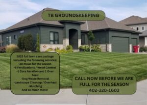 A freshly mowed residential lawn with clean stripes, showcasing quality lawn maintenance by TB Groundskeeping in Omaha, NE.