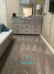 A freshly vacuumed carpet in a bedroom, showing cleaning lines, by Scarlet Cleaning Service LLC in Bronx, NY
