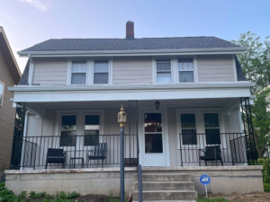 Front view of a charming house with newly installed light-colored horizontal siding by Ideal Siding Nashville, TN.