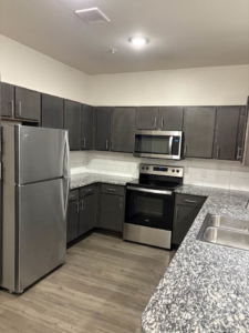 A full view of a clean and organized kitchen, showcasing the quality work of Jess Cleaning in San Antonio, TX.