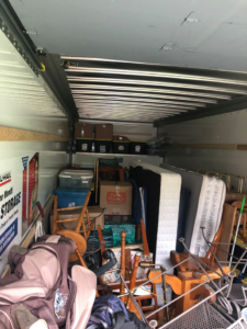 A fully loaded moving truck packed with various household items by Natural State Moving in Conway, AR.