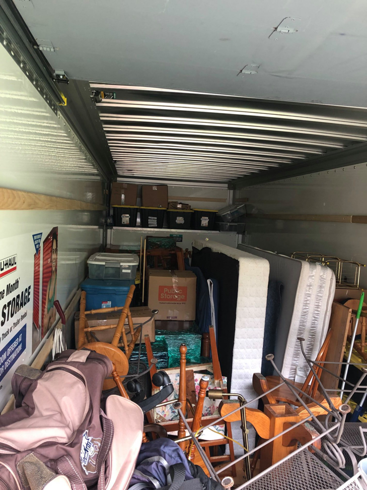 A fully loaded moving truck packed with various household items by Natural State Moving in Conway, AR.