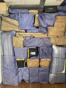 A moving truck fully packed with furniture and items wrapped in protective blankets and secured by Moving Marvels in Tucson, AZ.