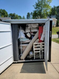 A fully packed storage unit with household items, managed by Rambling Man Logistics in Hildebran, NC.