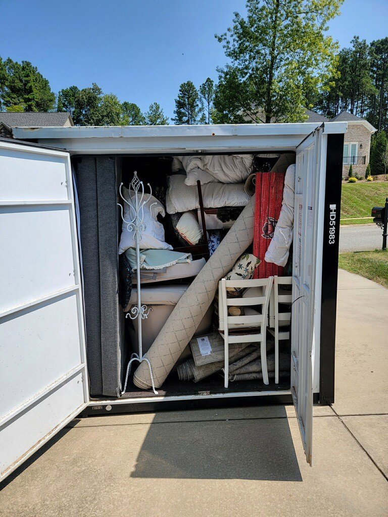 A fully packed storage unit with household items, managed by Rambling Man Logistics in Hildebran, NC.