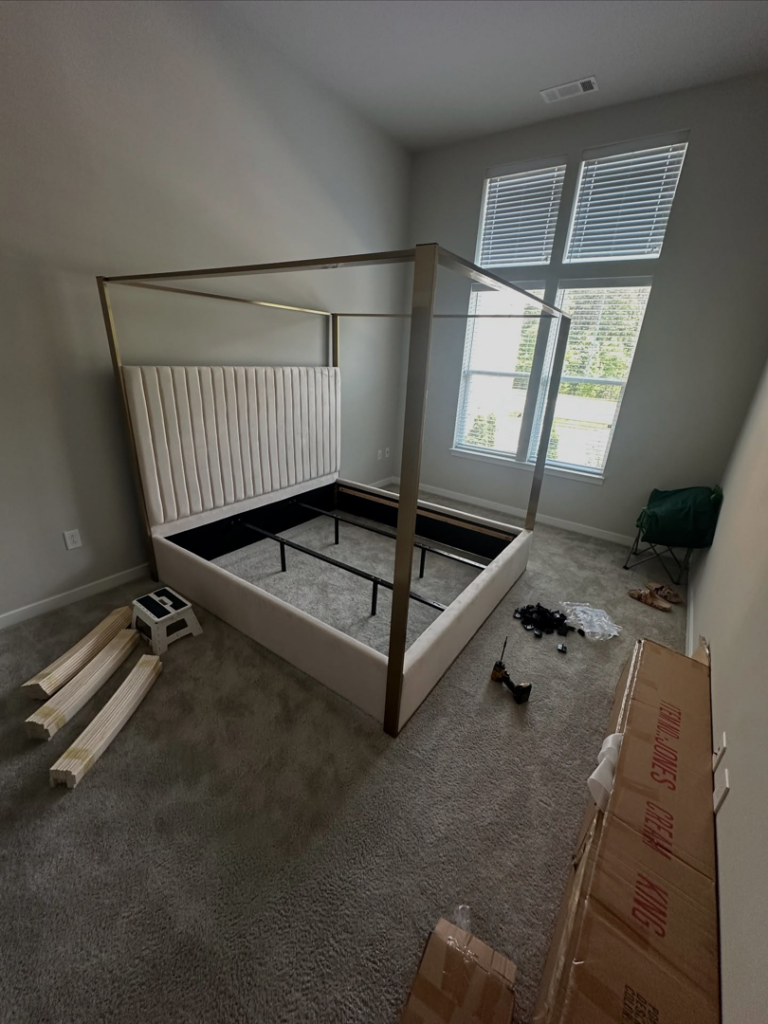 A partially assembled bed frame with tools and packaging, showcasing furniture assembly service by Mr Capitol Services llc in Laurel, MD.