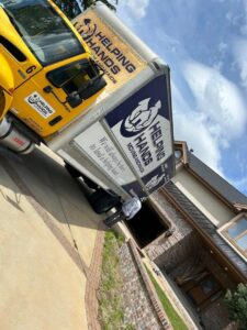 Furniture professionally wrapped in plastic for safe transport by Helping Hands Moving & Maids in Salt Lake City, UT.