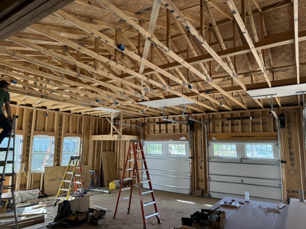 Interior view of garage door installation during construction by Garage Doors & More in Bentonville, AR
