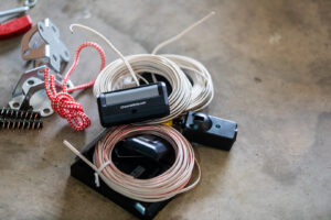 Various garage door opener components and parts laid out for installation by Bob McDonald Garage Door LLC in Columbus, NE.