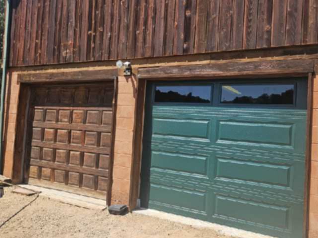 A side-by-side view showing an old wooden garage door next to a newly installed green garage door by 775 Overhead Doors in Carson City, NV.