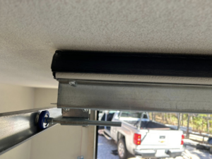 Close-up of a garage door roller and track system installed by Complete Garage Solutions NWA in Centerton, AR.