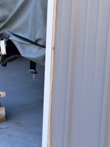 A close-up of a garage door's side gap and weather seal, demonstrating attention to detail by Overhead Door Company of Santa Fe in Santa Fe, NM.