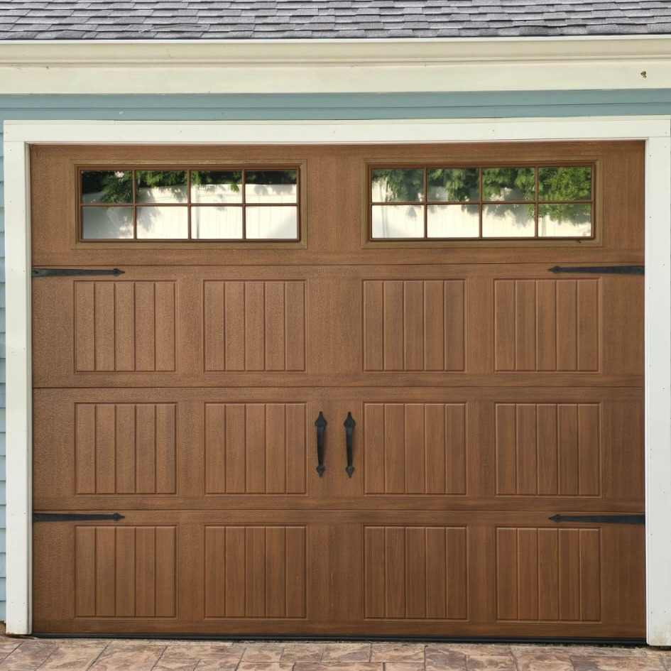 Two garage door technicians with a toolbox, ready for service from DNA Garage Door Repair in New Haven, CT