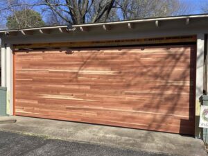 Interior view of a garage door showing torsion springs and tracks, serviced by Fayetteville Garage Door Co. in Fayetteville, AR
