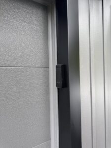 Close-up of garage door weather stripping and frame installed by Mascolo Overhead Doors & Maintenance in Brookfield, CT.