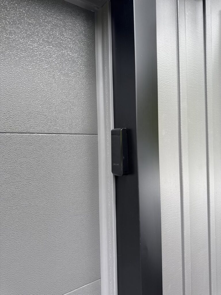 Close-up of garage door weather stripping and frame installed by Mascolo Overhead Doors & Maintenance in Brookfield, CT.