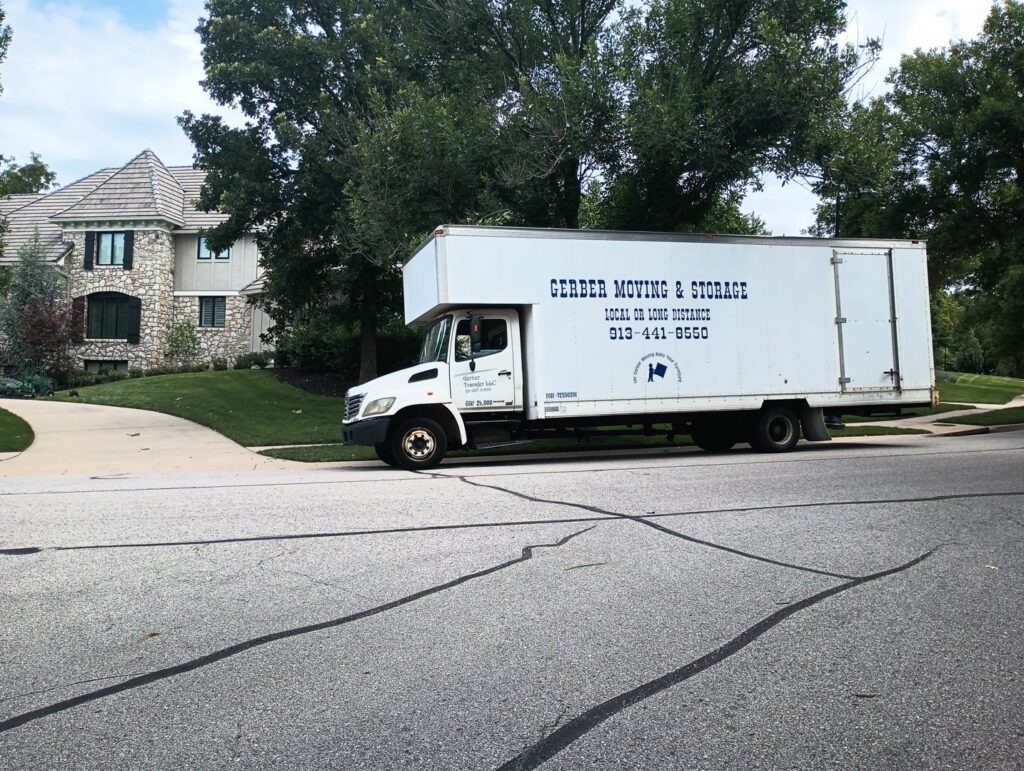 A Gerber Moving & Storage truck parked on a residential street, representing services by N. L. Wilson Moving and Storage in Olathe, KS.