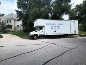 A Gerber Moving & Storage truck parked on a residential street, representing services by N. L. Wilson Moving and Storage in Olathe, KS.
