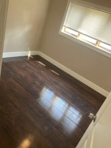 Gleaming hardwood floor reflecting sunlight after professional cleaning by Genetic Solutions in Milwaukee, WI.
