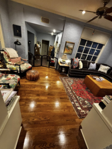 A living room with gleaming hardwood floors, showcasing the meticulous cleaning services provided by BuzzSide Cleaning LLC in Little Rock, AR.