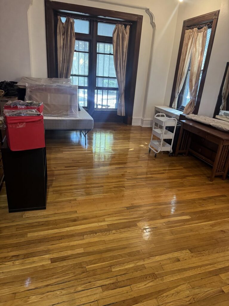 A residential room with gleaming hardwood floors, reflecting the quality cleaning services from Statewide cleaning services llc in Philadelphia, PA.