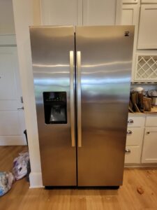 A gleaming stainless steel refrigerator, reflecting the high-quality appliance cleaning services of AG Simply Clean in Concord, NC.