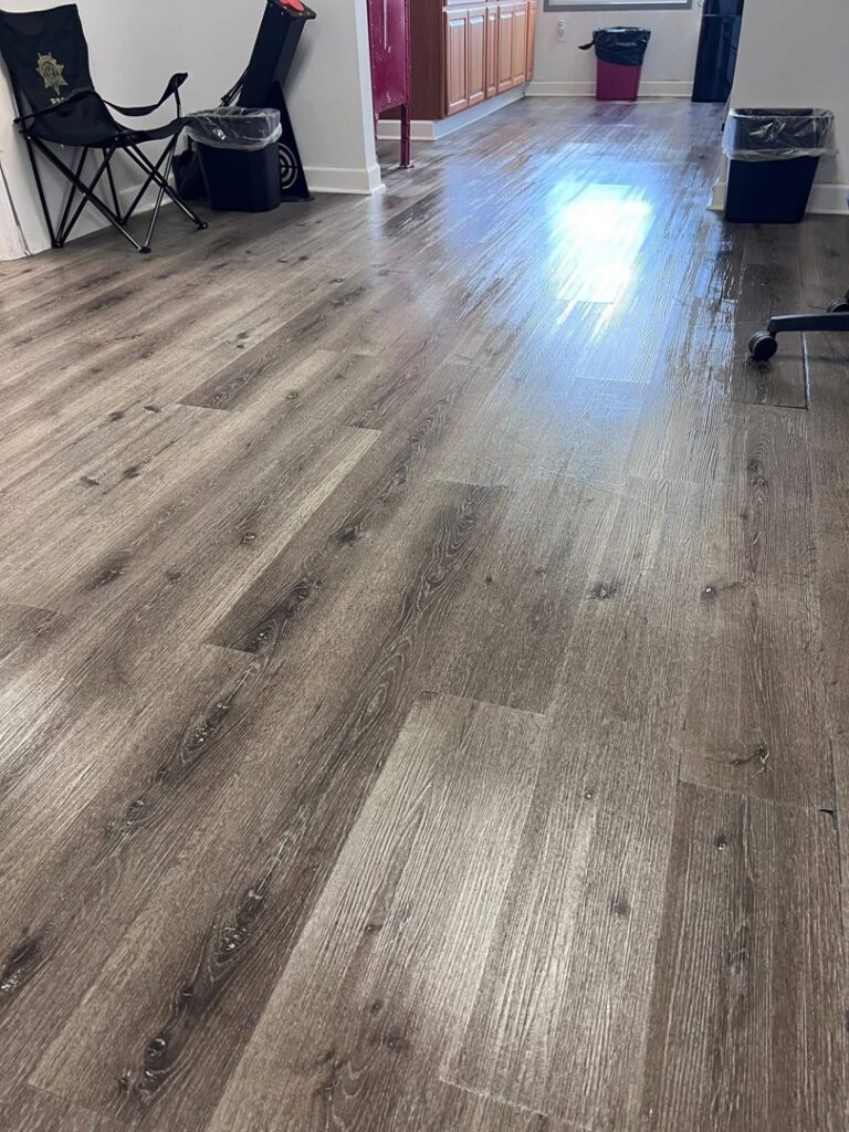 A gleaming wooden floor in a home hallway, showcasing the floor cleaning expertise of JBO Cleaning Services in Belle Chasse, LA.