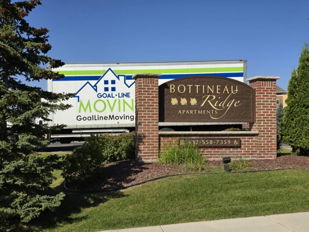A Goal Line Moving truck parked at Bottineau Ridge Apartments in Maple Grove, MN.