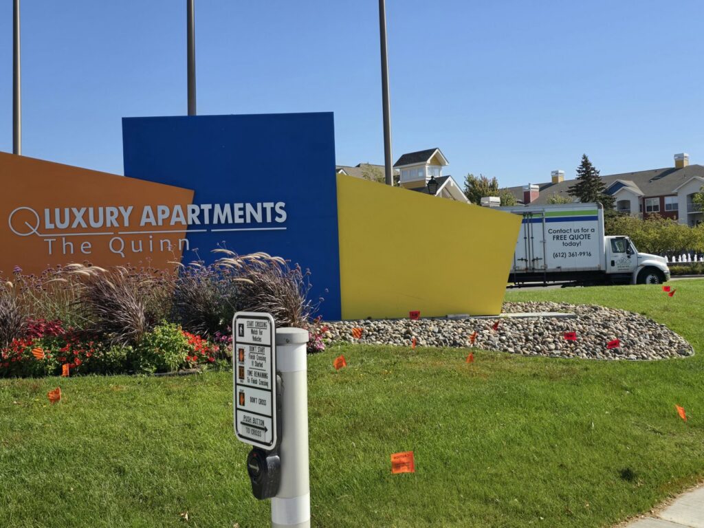 A Goal Line Moving truck parked at The Quinn Luxury Apartments in Maple Grove, MN.