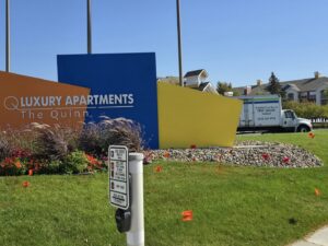 A Goal Line Moving truck parked at The Quinn Luxury Apartments in Maple Grove, MN.