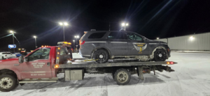 Goat Towing flatbed truck providing towing services for an Ohio State Highway Patrol SUV in Dayton, OH.
