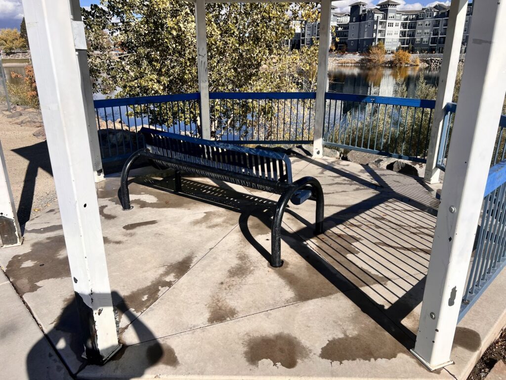 Graffiti on a gazebo floor before cleaning by EB Restorations & Cleaning Services in Sparks, NV
