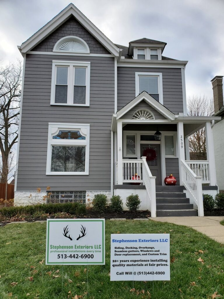 A newly installed gray siding on a residential home with white trim by Stephenson Exteriors LLC in Cincinnati, OH.