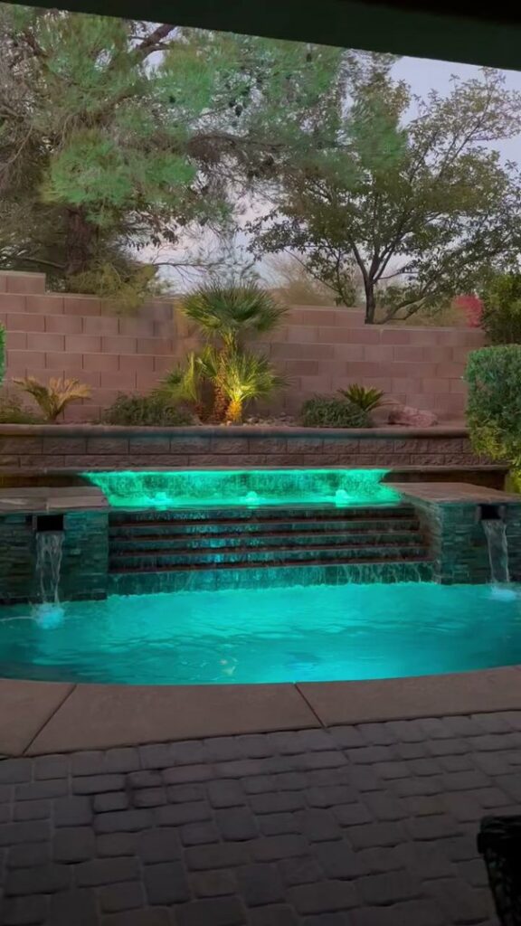 A swimming pool with green, murky water, indicating the need for professional cleaning services from Aloha Pool Cleaning LLC in Las Vegas, NV.