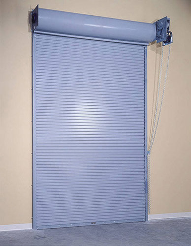 A grey rolling steel garage door, a product offered by Vertical Door Solutions in Sheridan, WY