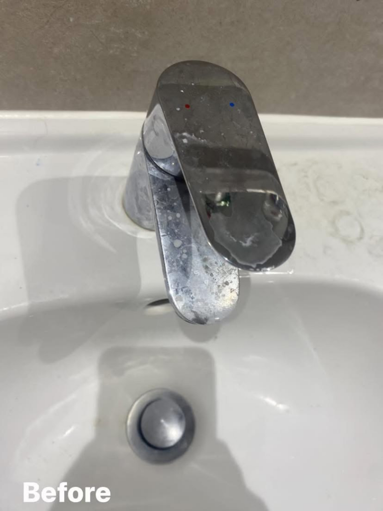A grimy bathroom faucet with hard water stains before cleaning by Nicy Cleaning Service in Danbury, CT.