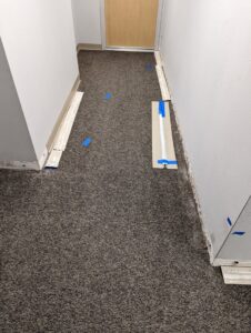Hallway with baseboards removed and lower walls prepped for water damage repair by Restoration Services Hawaii - RestHi in Honolulu, HI.