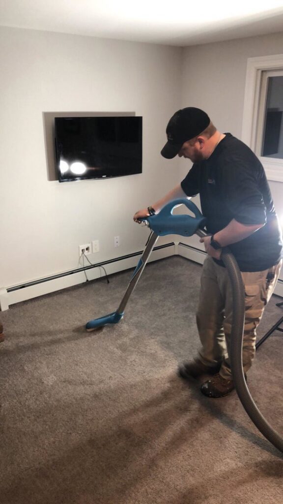 Multiple air movers and dehumidifiers drying a carpeted hallway after water damage by Restoration 1 of Birmingham in Pelham, AL.