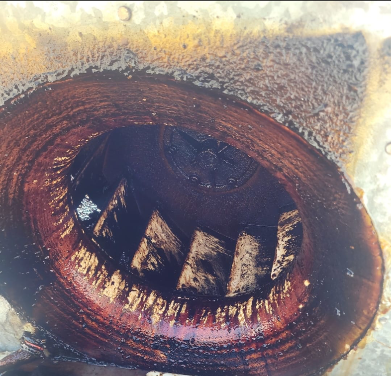 A heavily greased and dirty exhaust fan interior before deep cleaning by Bernal Cleaning LLC in Overland Park, KS.